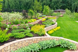 - Search Strategy Marketing Natural landscaping with low retaining walls and plants in home garden